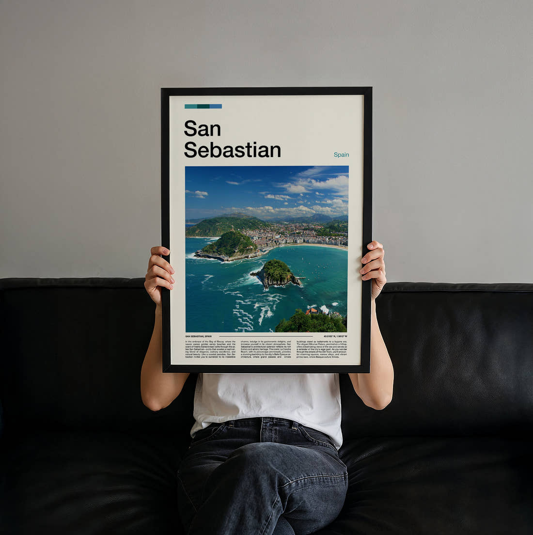 San Sebastian La Concha Bay Travel Print held up by hand to show the size of the print