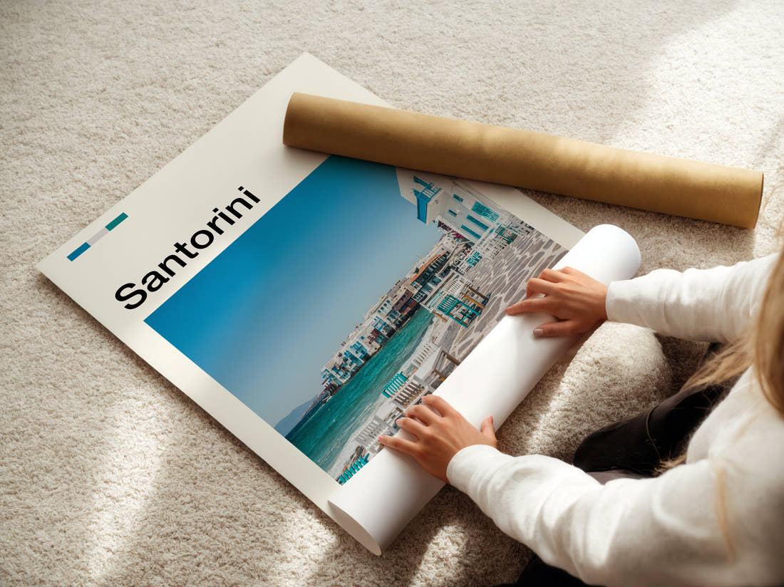 Santorini Waterfront Terrace Travel Print being unrolled from its postal tube