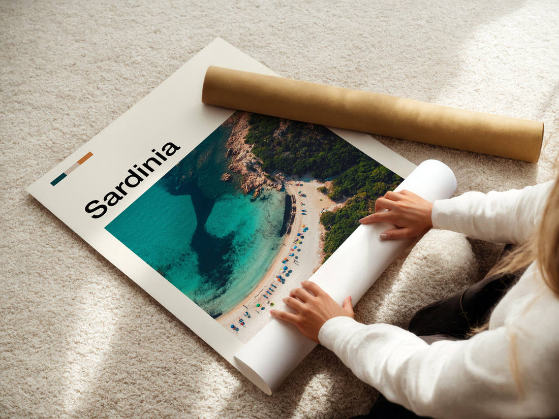 Sardinia Turquoise Cove Aerial Travel Print being unrolled from its postal tube