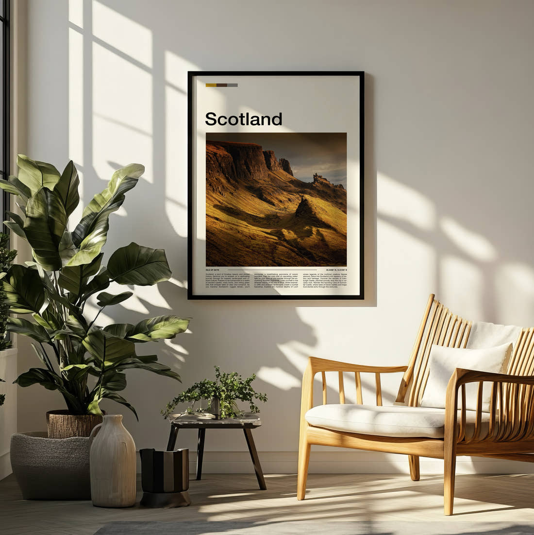 Scotland The Quiraing Travel Print framed on a pale wall beside houseplants