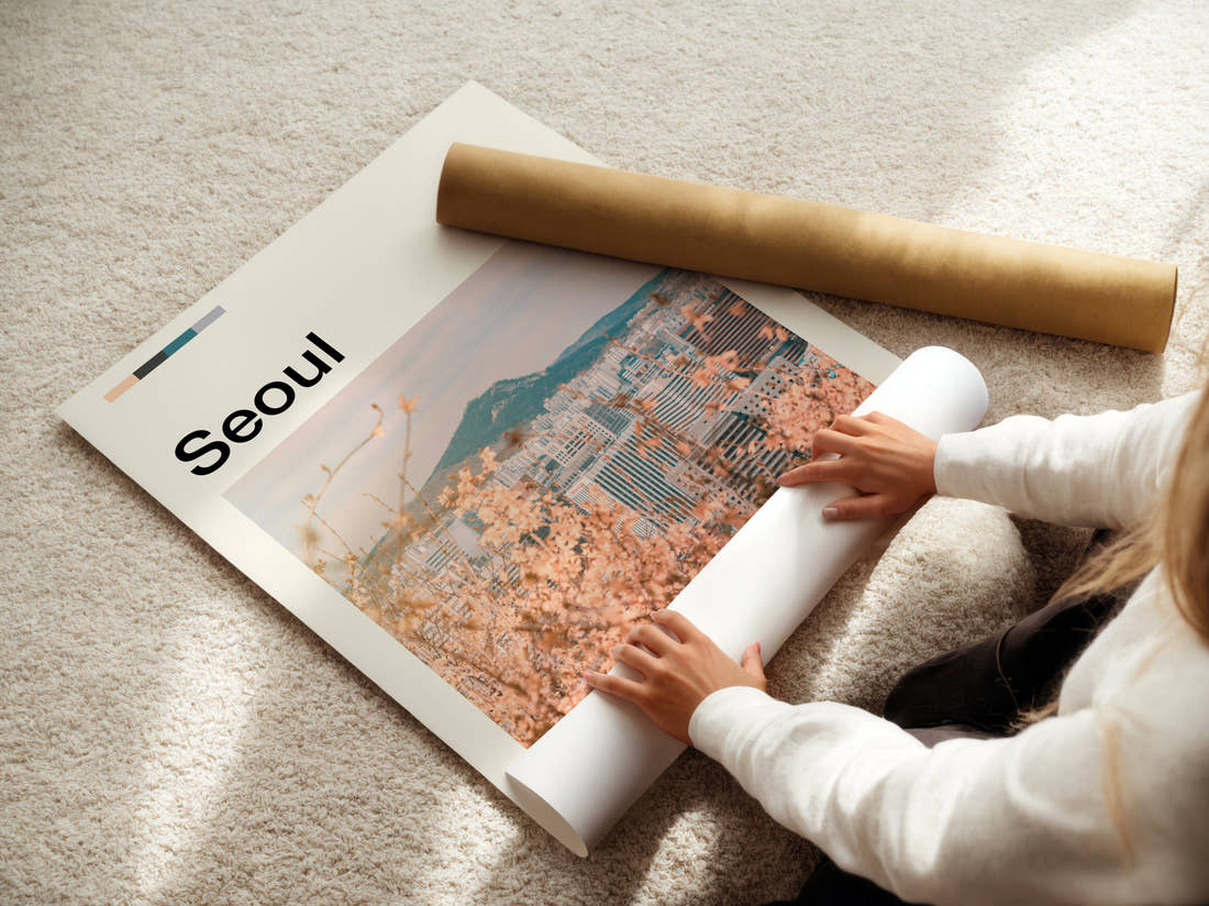 Seoul Cherry Blossom And Skyline Travel Print being unrolled from its postal tube