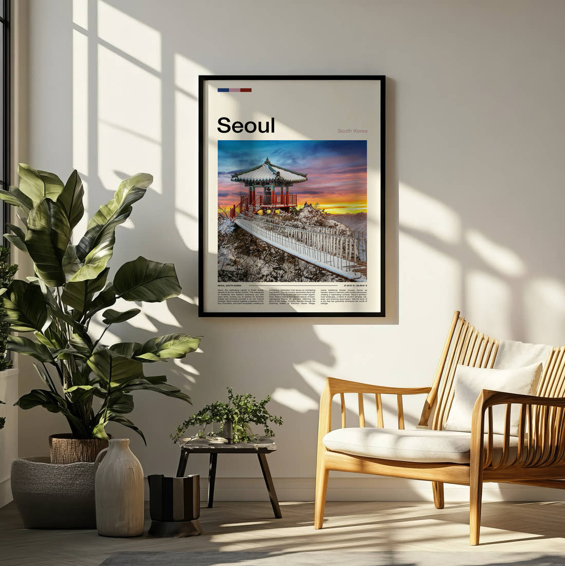 Seoul Traditional Pavilion In Snow Travel Print framed on a pale wall beside houseplants