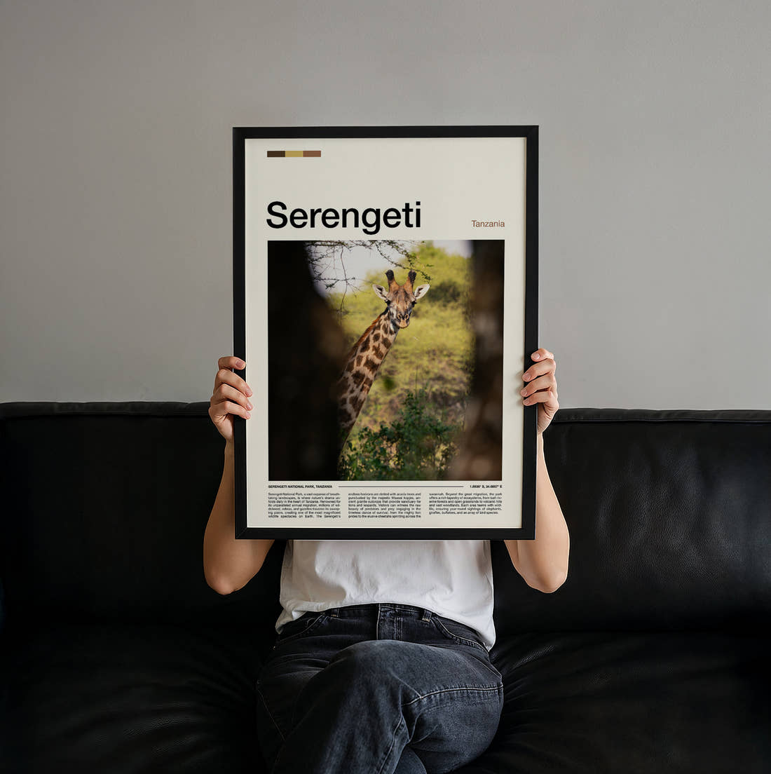 Serengeti Giraffe Travel Print held up by hand to show the size of the print
