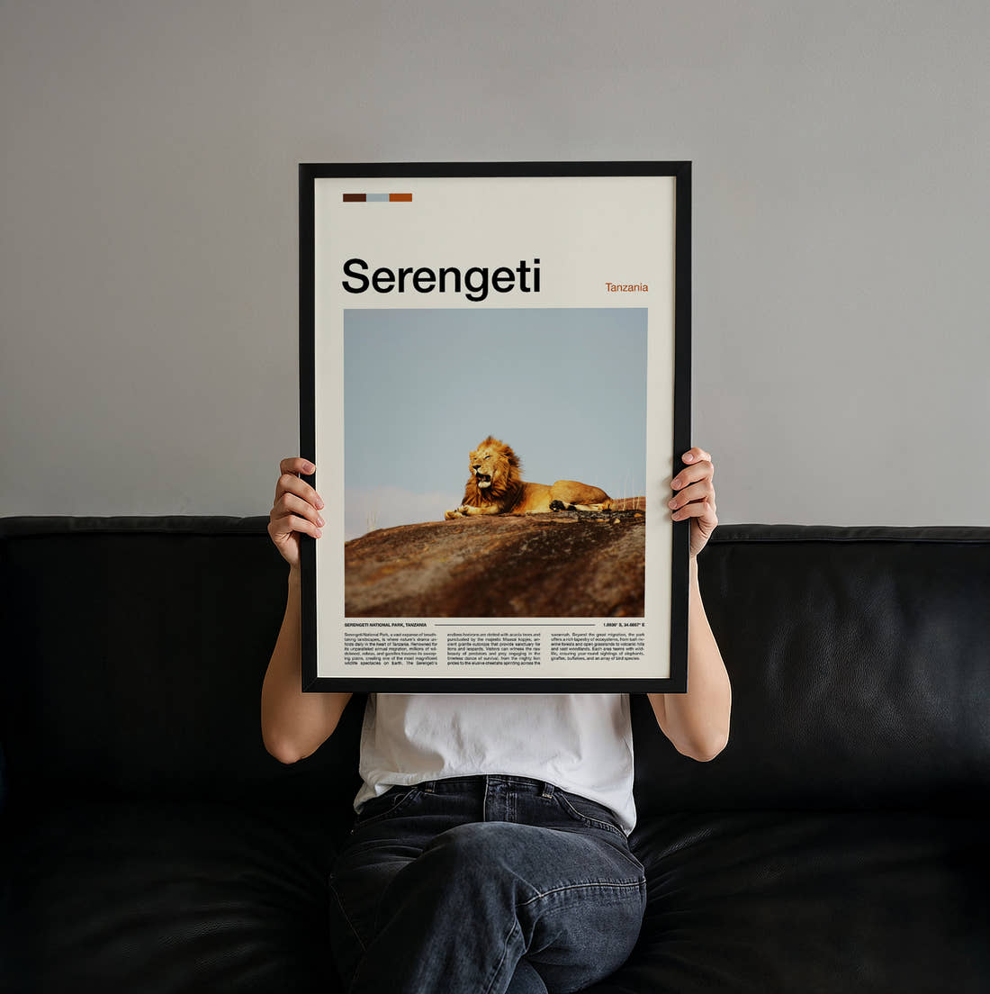 Serengeti Lion Resting Travel Print held up by hand to show the size of the print
