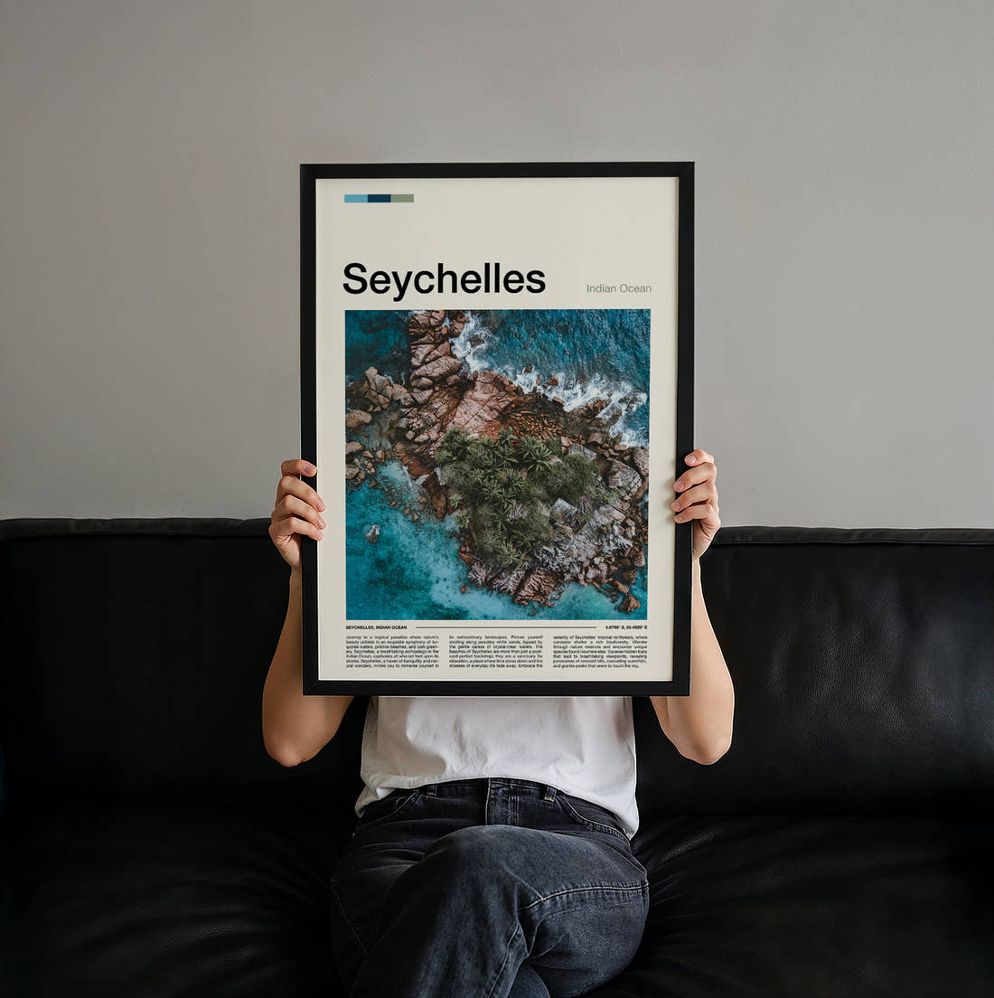 Seychelles Aerial Rocky Coast Travel Print held up by hand to show the size of the print