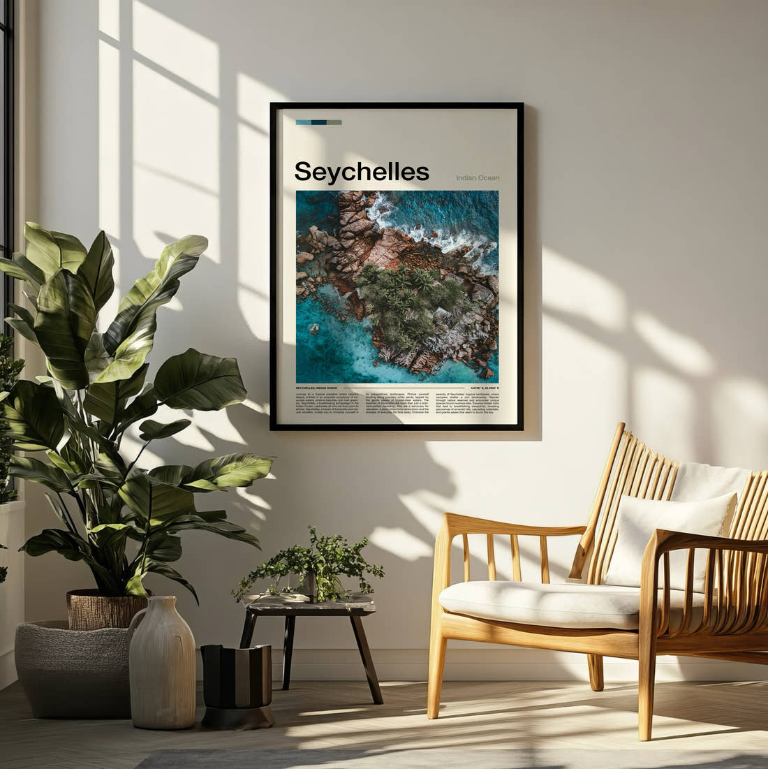 Seychelles Aerial Rocky Coast Travel Print framed on a pale wall beside houseplants