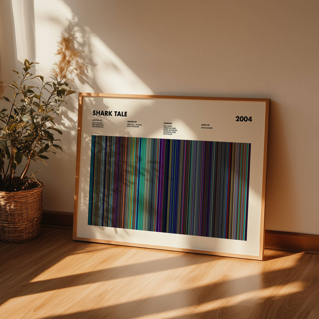 Shark Tale Movie Barcode Poster framed and leaning against a wall on a wooden floor