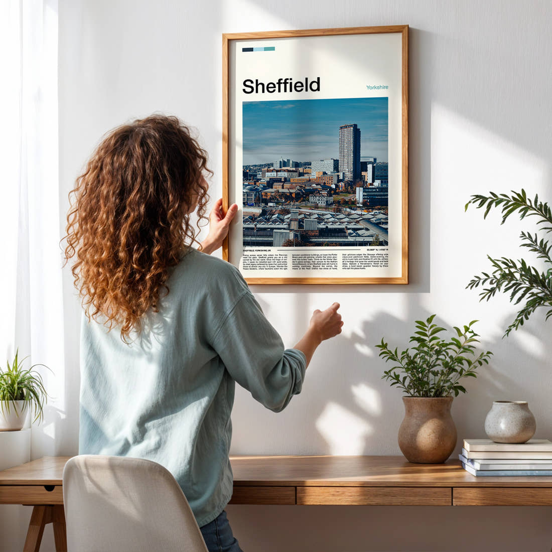 Sheffield City Skyline View Travel Print framed on a pale wall beside houseplants
