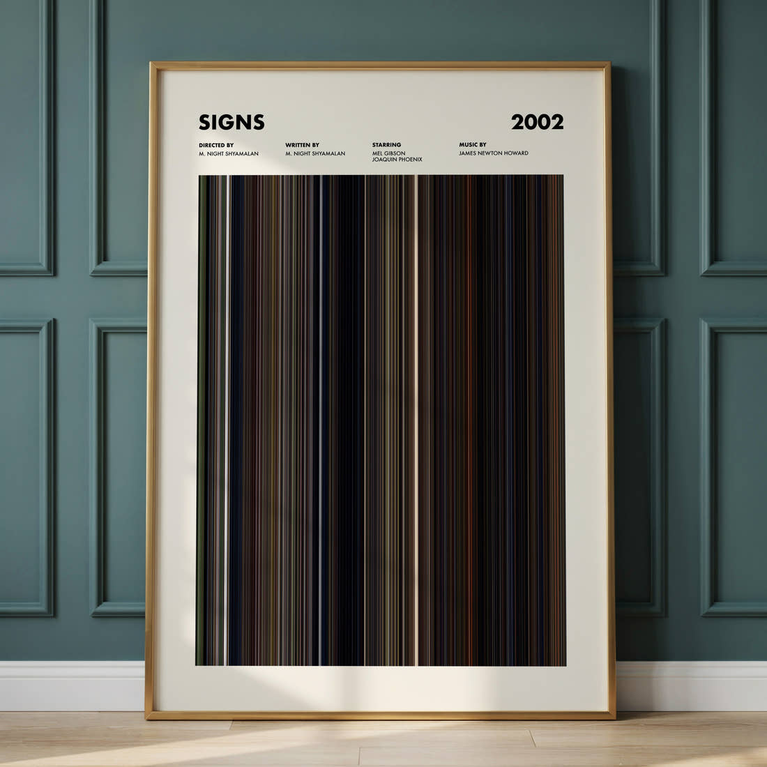 Signs Movie Barcode Poster framed and leaning against a panelled wall
