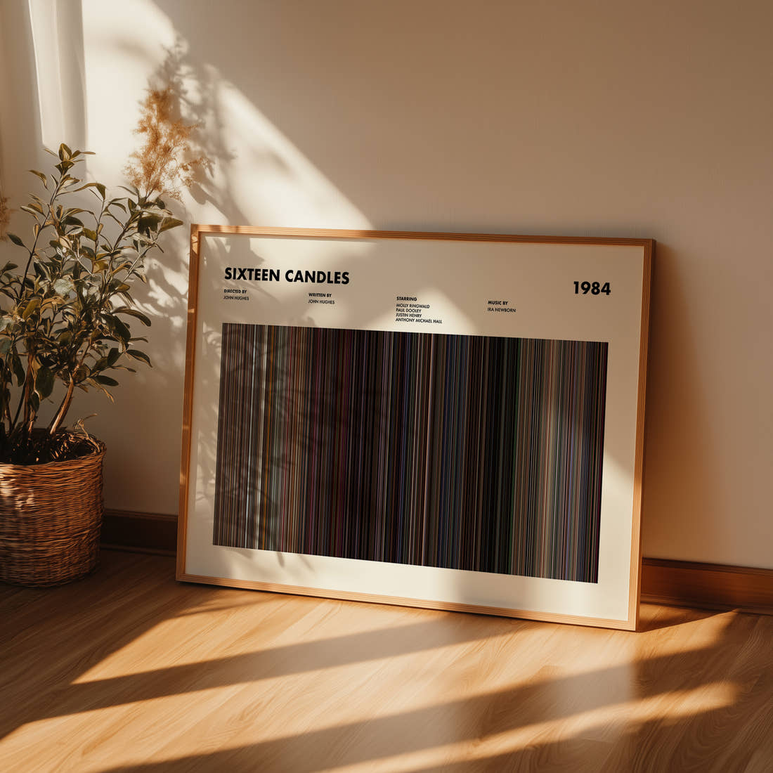 Sixteen Candles Movie Barcode Poster framed and leaning against a wall on a wooden floor