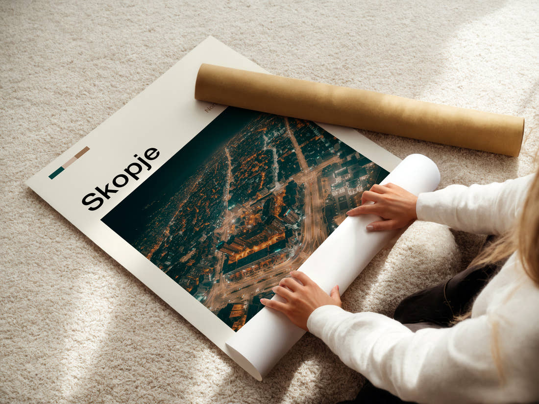 Skopje Illuminated City Sprawl Travel Print being unrolled from its postal tube