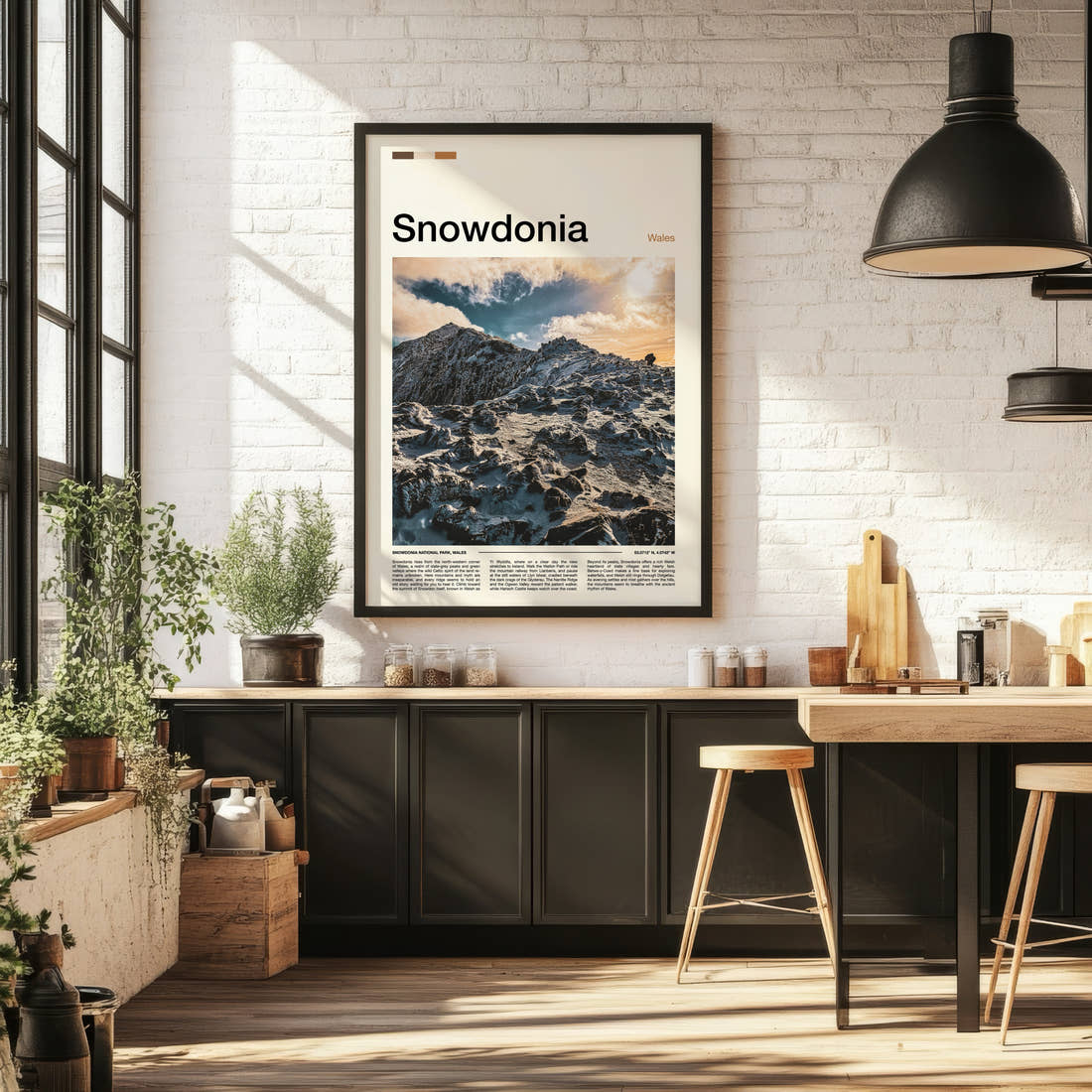 Snowdonia Snowbound Ridge Summit Travel Print framed on the wall of a bright kitchen and dining space