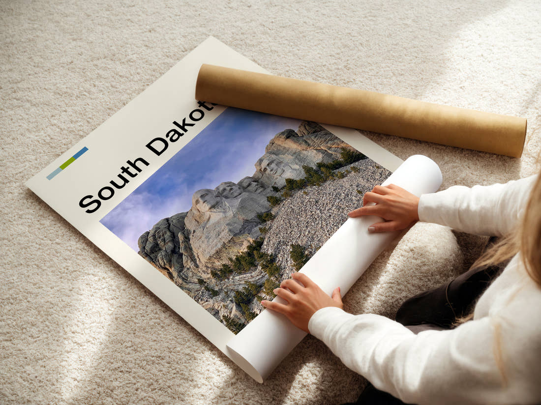 South Dakota Mount Rushmore Travel Print being unrolled from its postal tube
