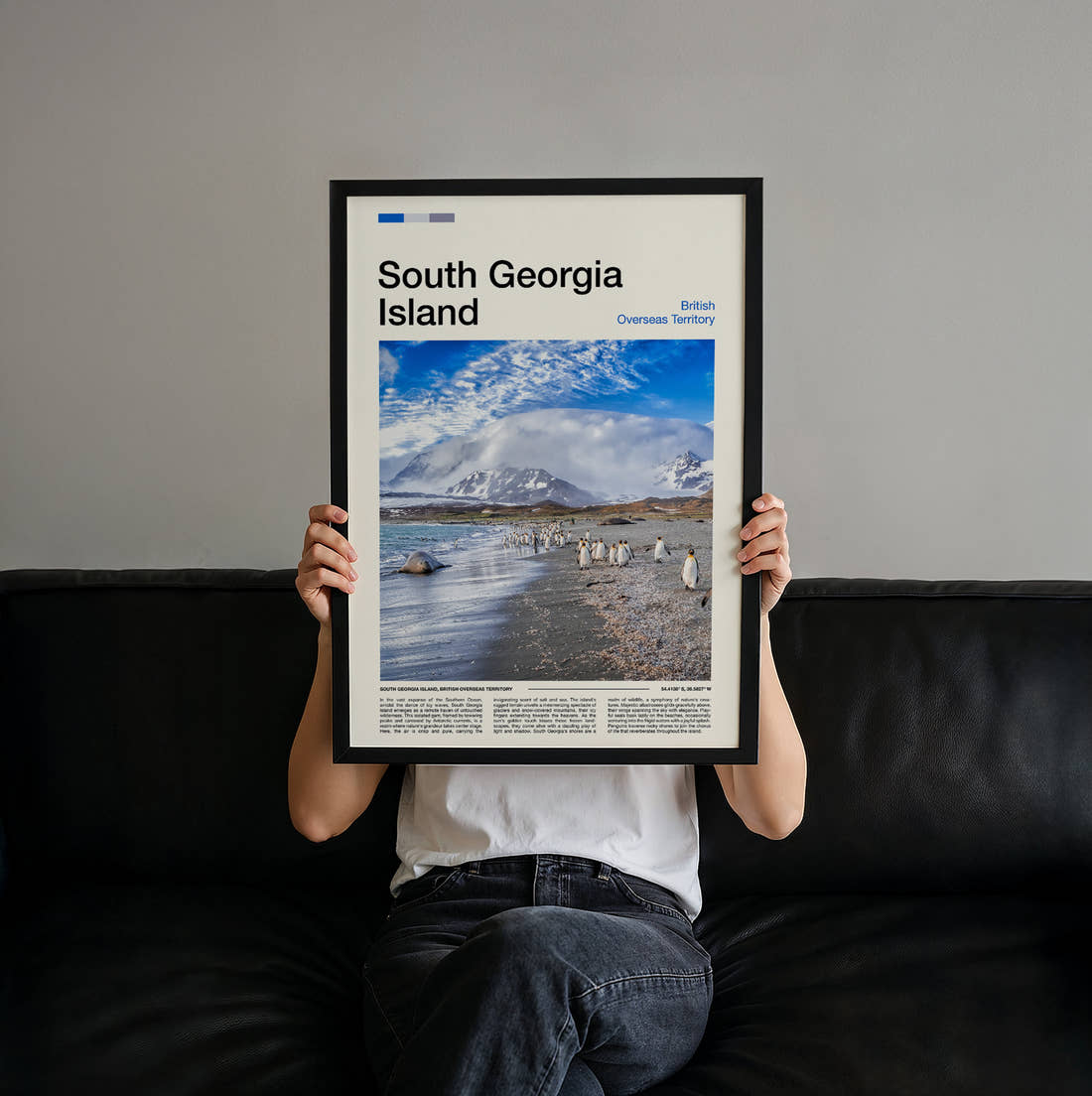 South Georgia Penguins On The Beach Travel Print held up by hand to show the size of the print