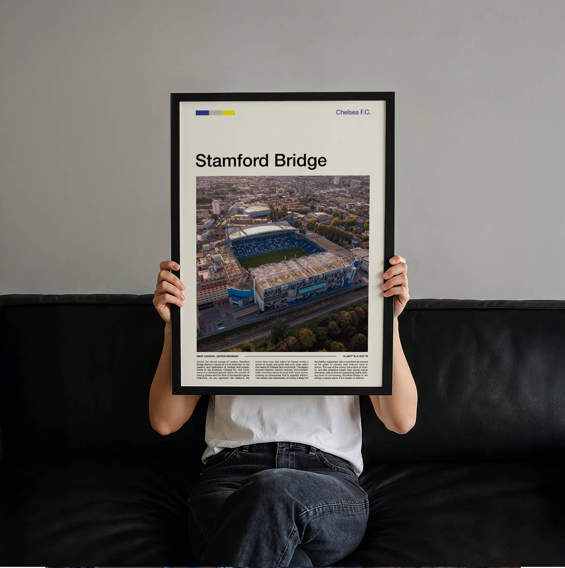 Stamford Bridge Stadium Print held up by hand to show the size of the print