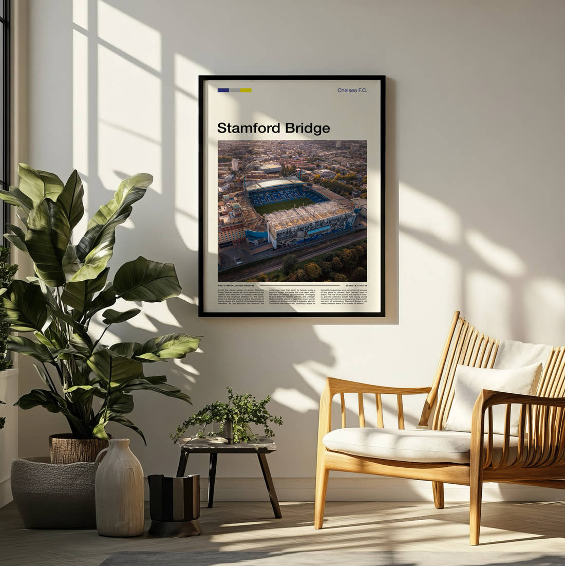 Stamford Bridge Stadium Print framed on a pale wall beside houseplants