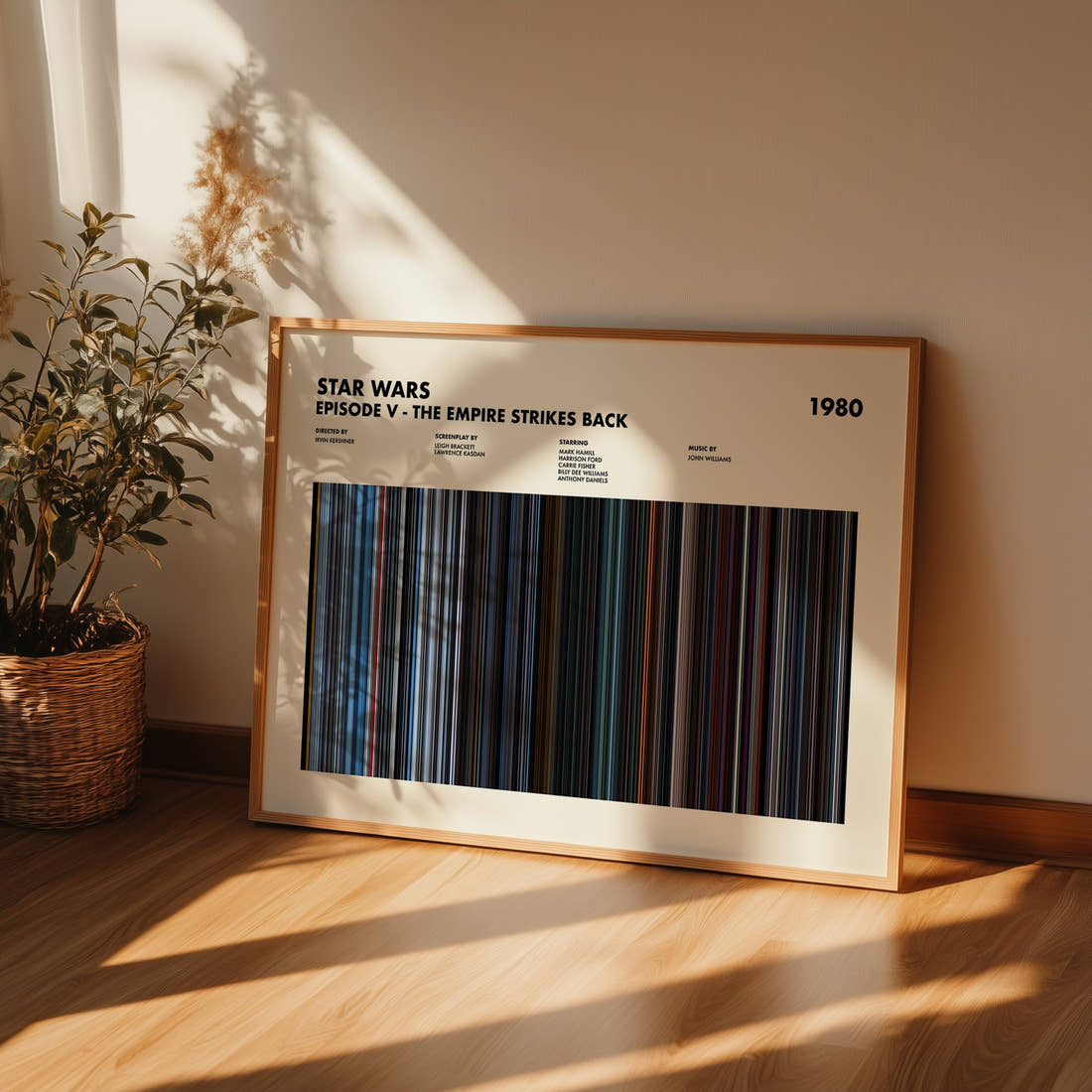 Star Wars: Episode V The Empire Strikes Back Movie Barcode Poster framed and leaning against a wall on a wooden floor