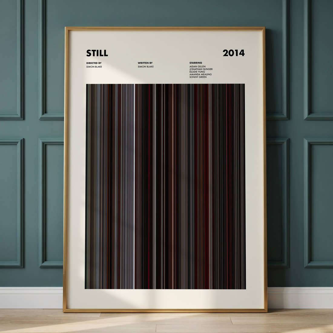 Still Movie Barcode Poster framed and leaning against a panelled wall