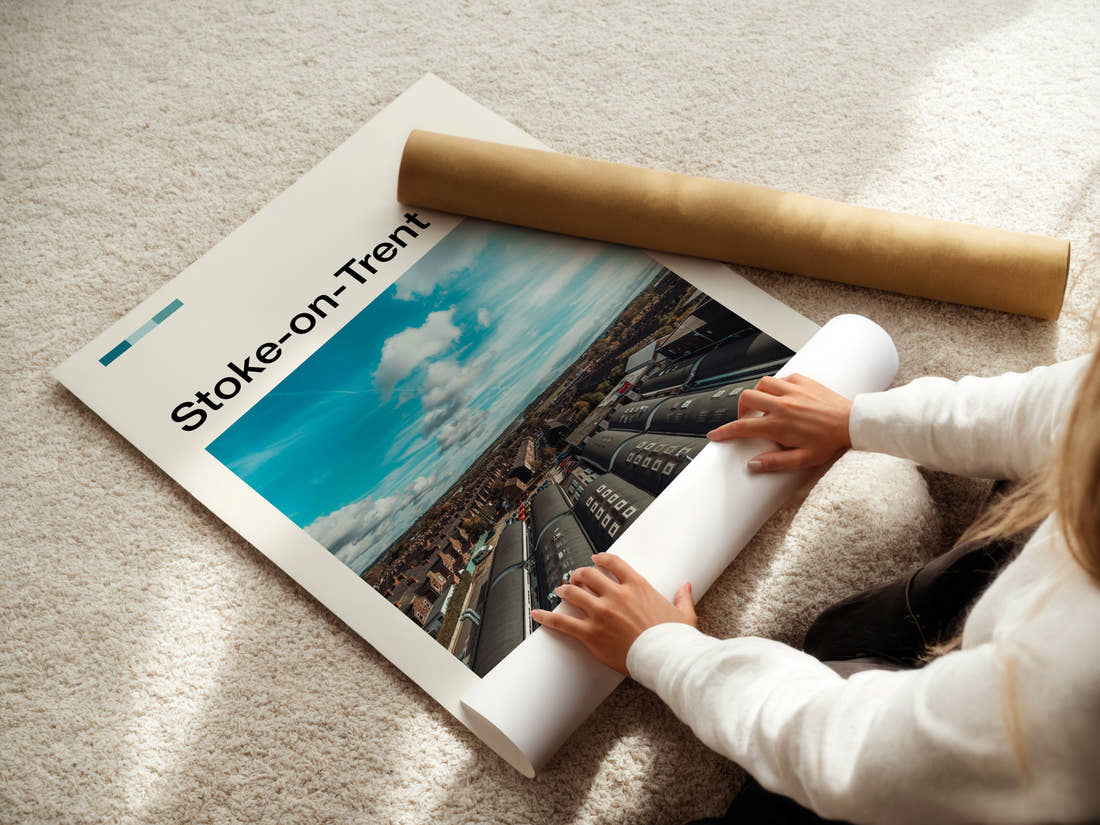 Stoke-on-Trent Bottle Kiln Rooftops Travel Print being unrolled from its postal tube