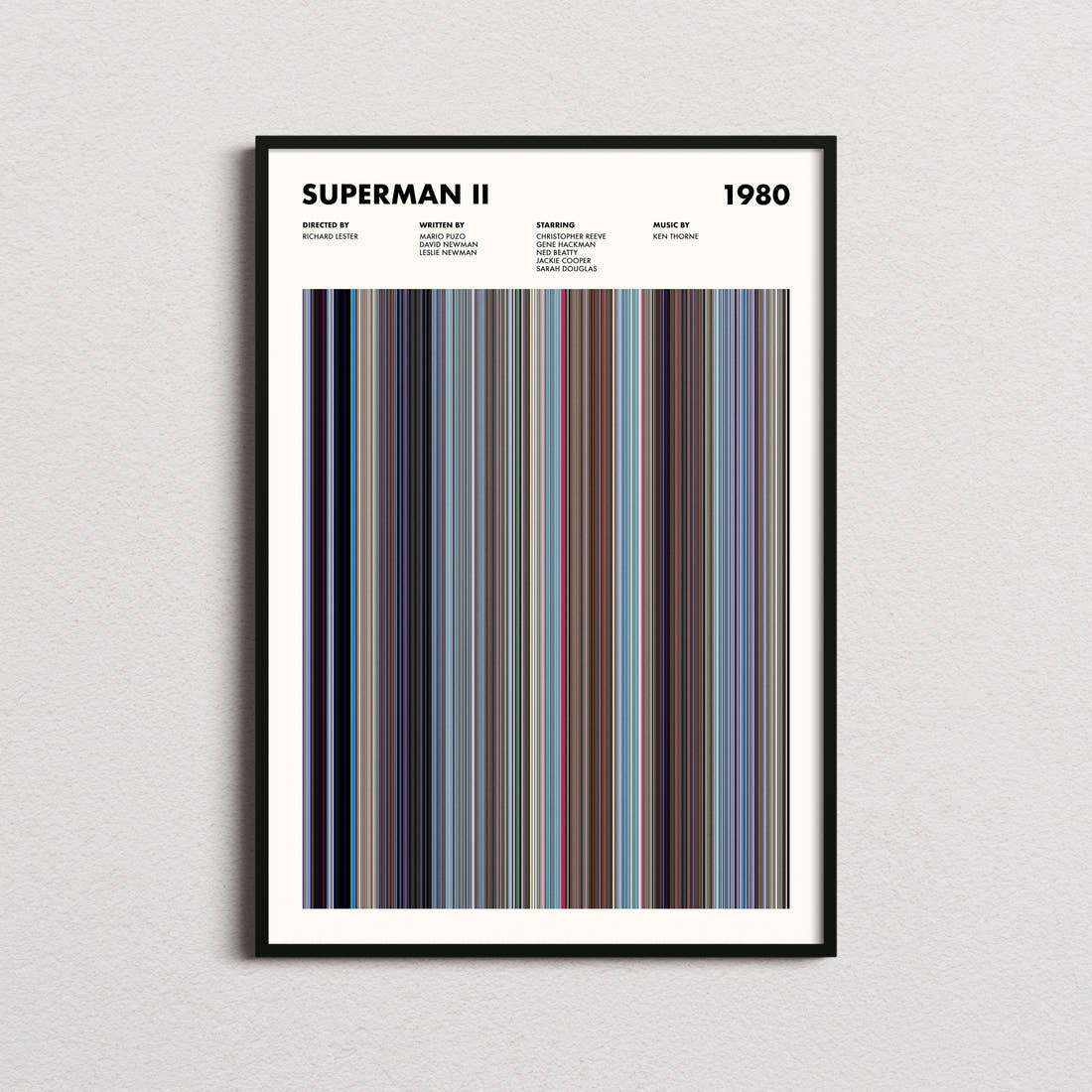 Superman 2 Movie Barcode Poster framed on a plain studio wall