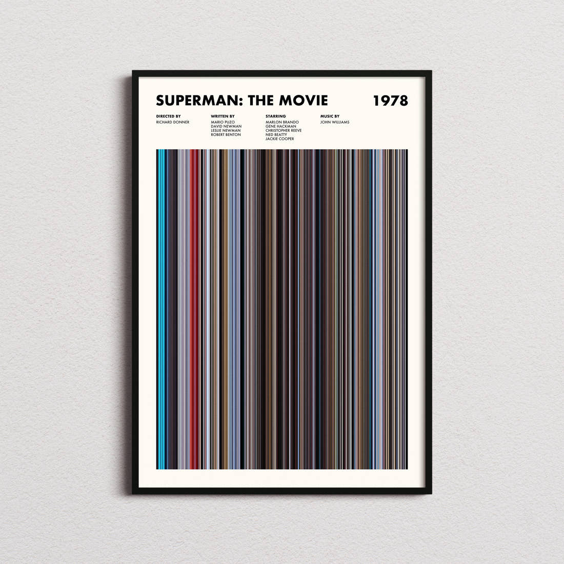 Superman Movie Barcode Poster framed on a plain studio wall