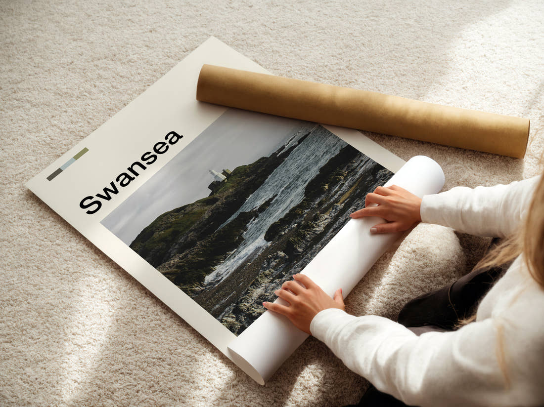 Swansea Mumbles Lighthouse Travel Print being unrolled from its postal tube