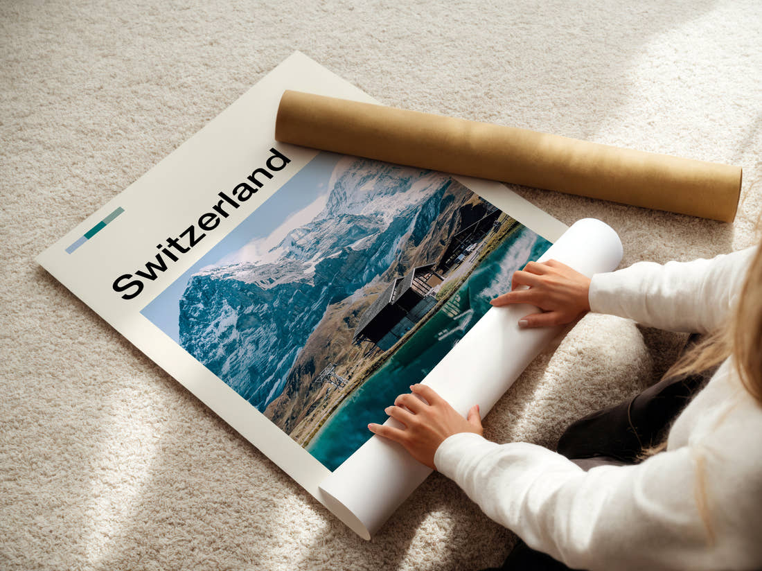 Switzerland Alpine Lake And Chalets Travel Print being unrolled from its postal tube