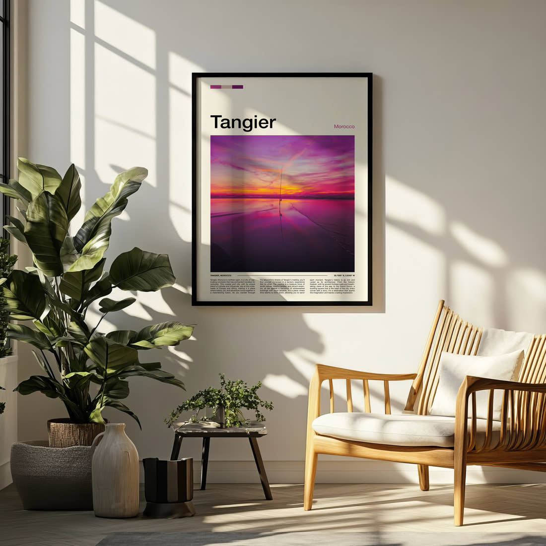 Tangier Pink Sunset Over Water Travel Print framed on a pale wall beside houseplants