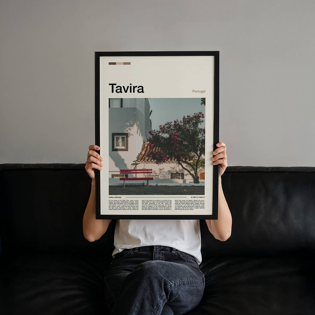 Tavira Whitewashed Courtyard Corner Travel Print held up by hand to show the size of the print
