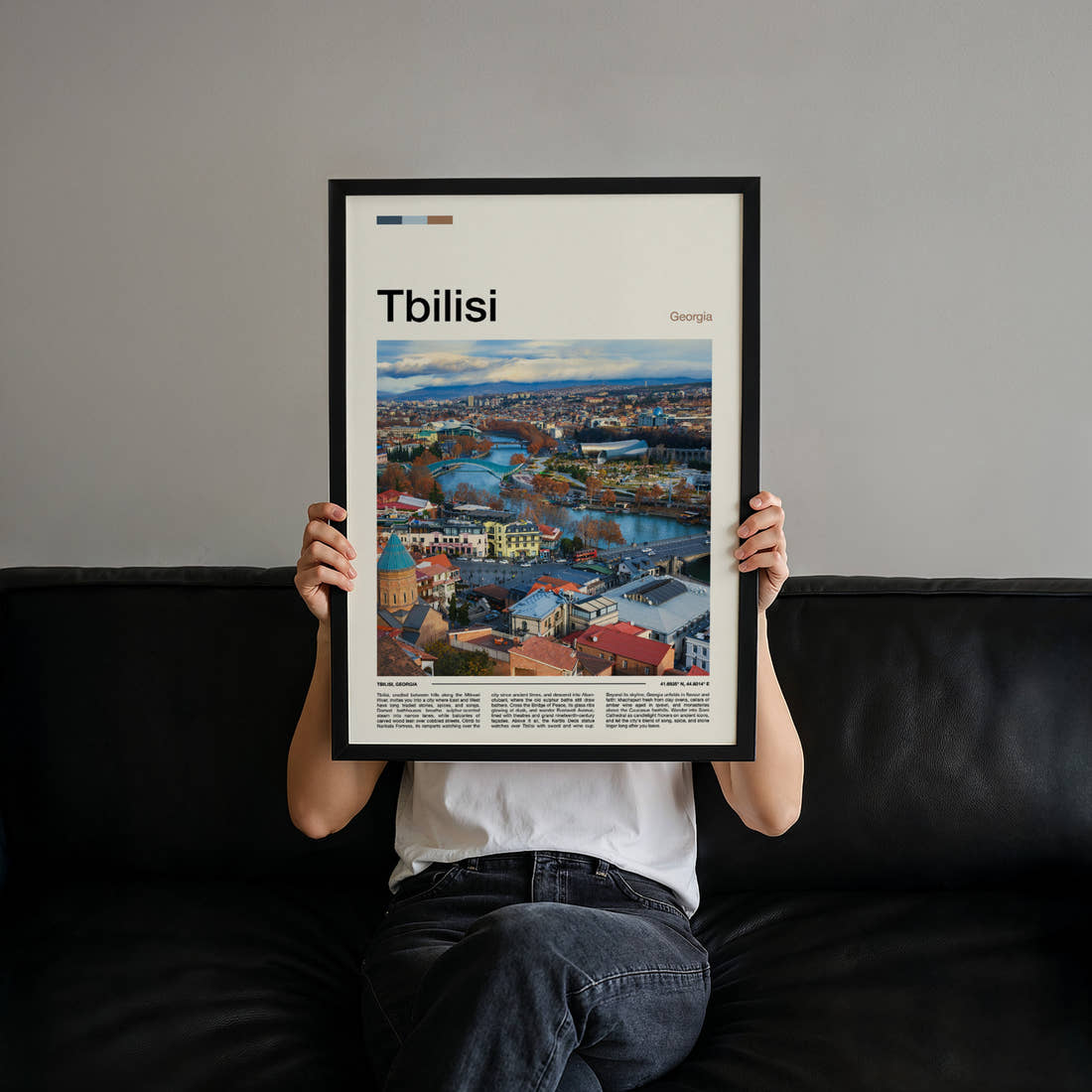Tbilisi Riverside City View Travel Print held up by hand to show the size of the print