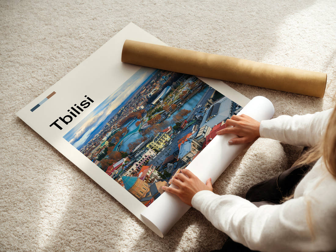 Tbilisi Riverside City View Travel Print being unrolled from its postal tube