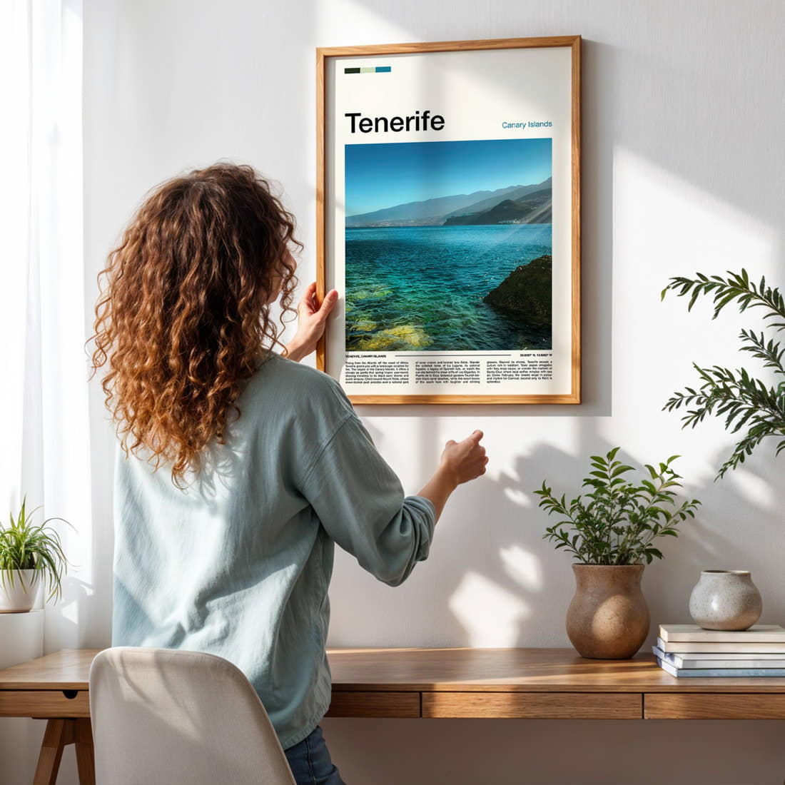 Tenerife Turquoise Coastal Waters Travel Print framed on a pale wall beside houseplants