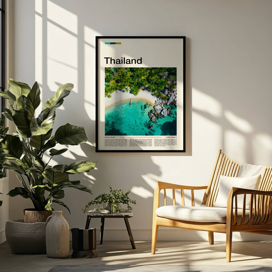Thailand Aerial Beach And Rocks Travel Print framed on a pale wall beside houseplants