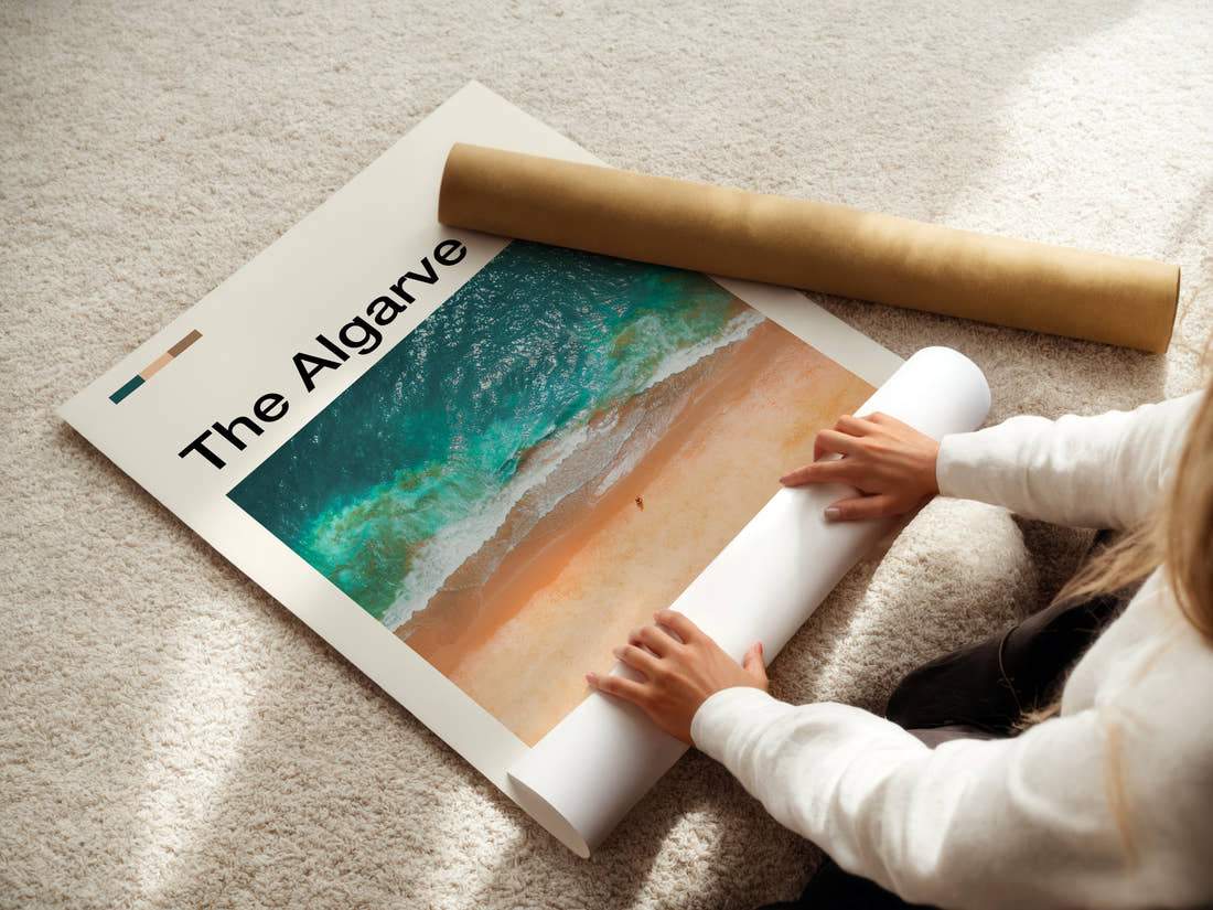 The Algarve Aerial Coastal Waves Travel Print being unrolled from its postal tube