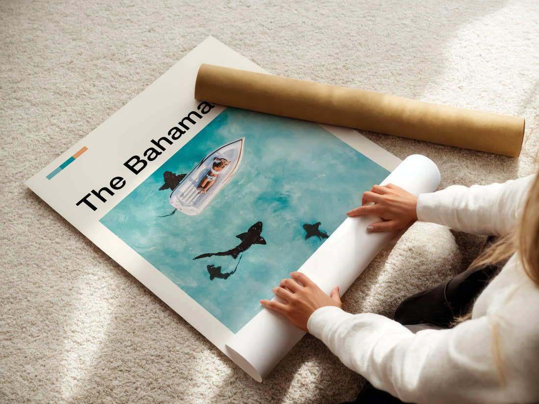 The Bahamas Sharks Beside A Boat Travel Print being unrolled from its postal tube