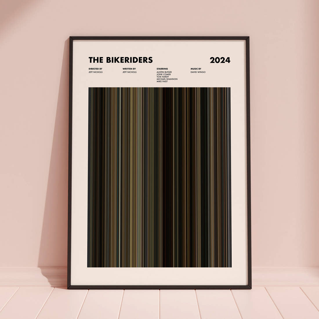 The Bikeriders Movie Barcode Poster framed and leaning against a coloured wall