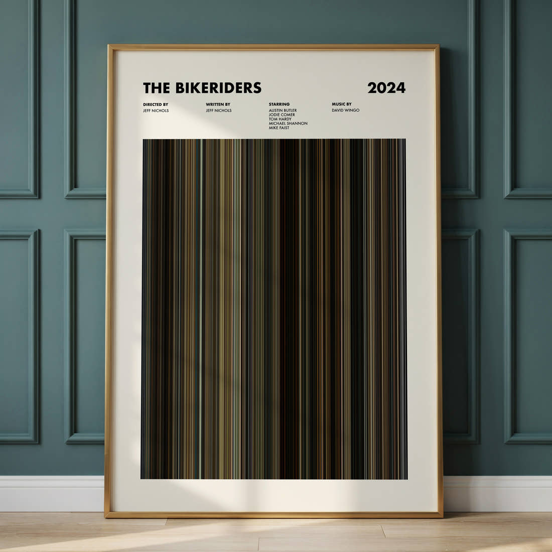 The Bikeriders Movie Barcode Poster framed and leaning against a panelled wall
