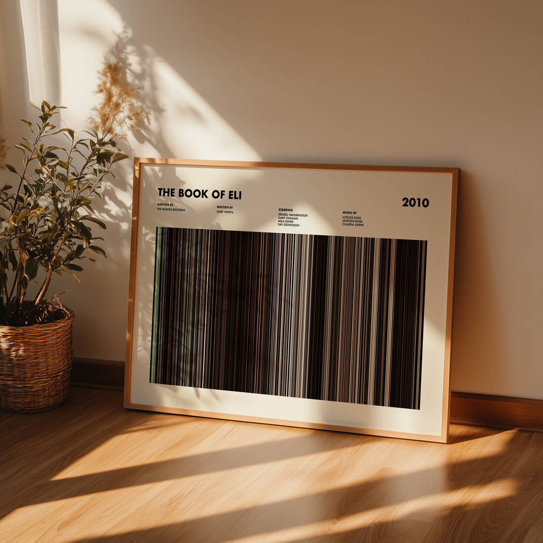 The Book Of Eli Movie Barcode Poster framed and leaning against a wall on a wooden floor