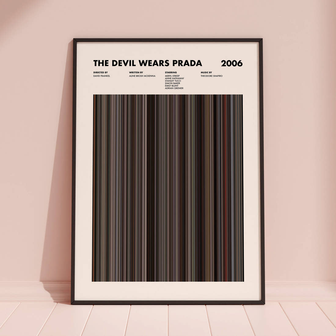 The Devil Wears Prada Movie Barcode Poster framed and leaning against a coloured wall