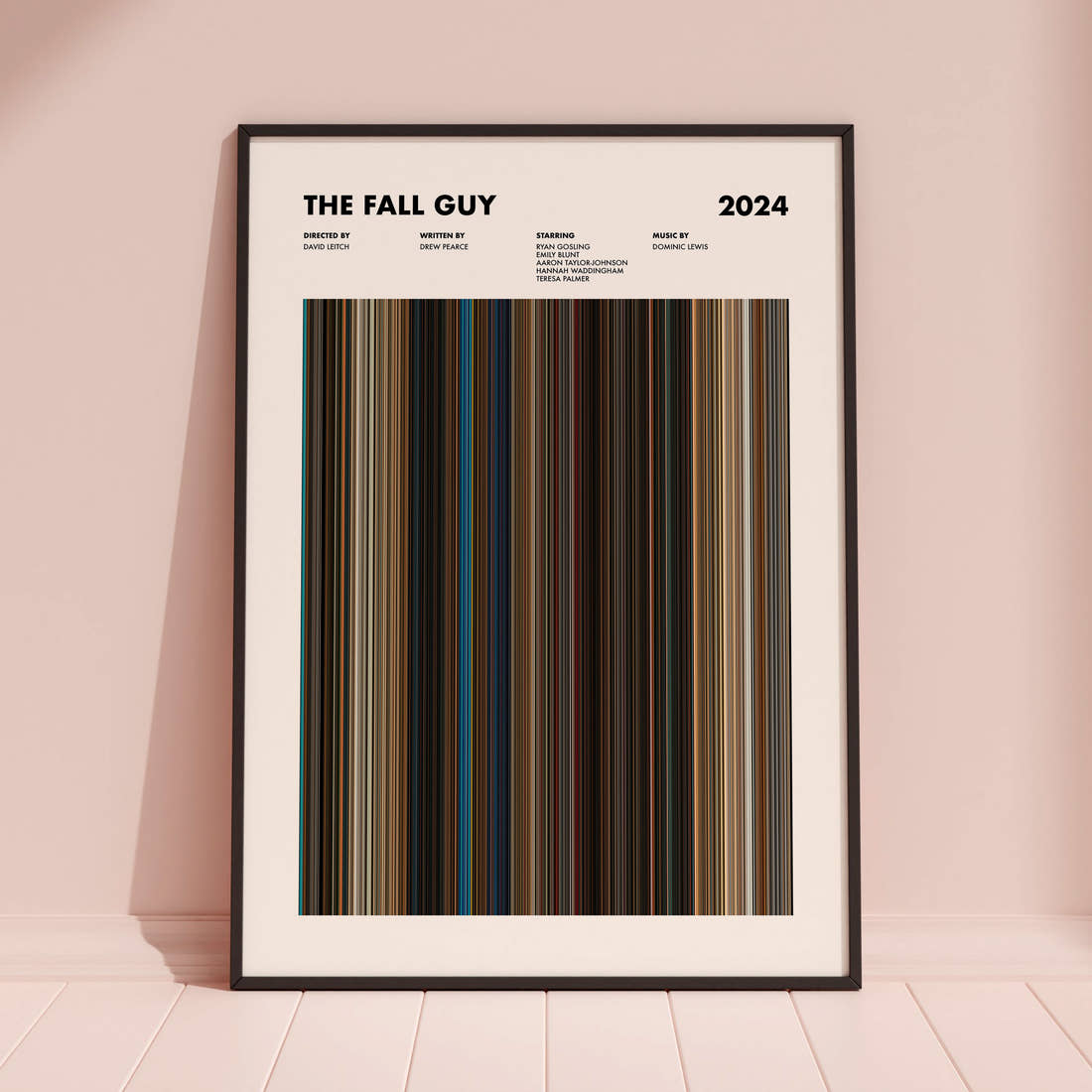 The Fall Guy Movie Barcode Poster framed and leaning against a coloured wall