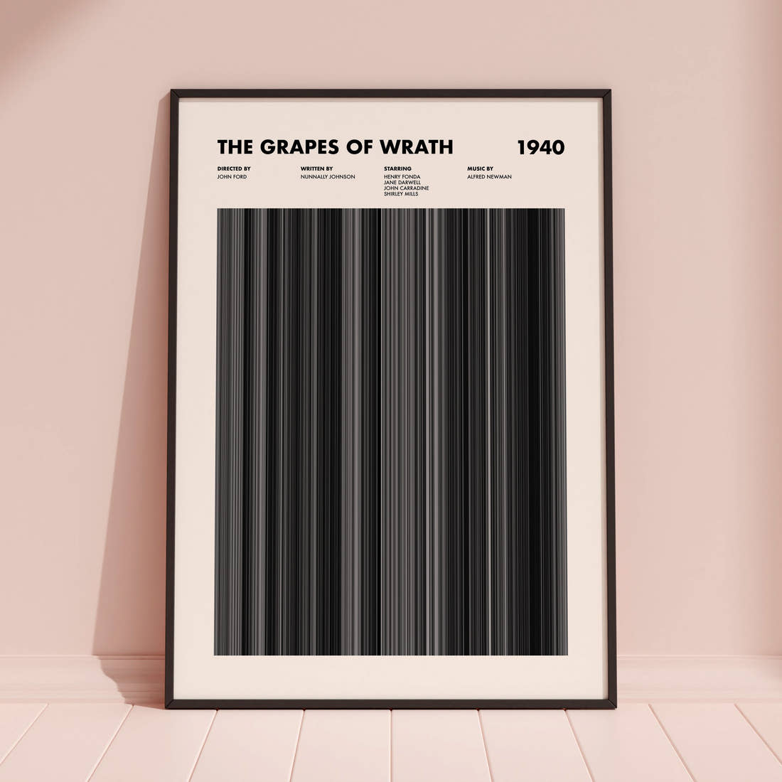 The Grapes Of Wrath Movie Barcode Poster framed and leaning against a coloured wall