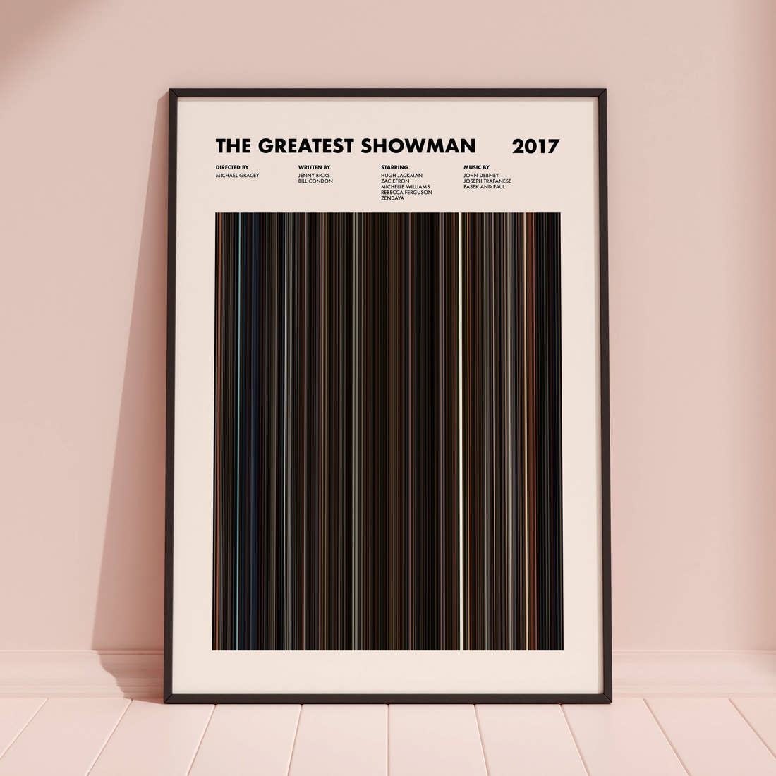 The Greatest Showman Movie Barcode Poster framed and leaning against a coloured wall