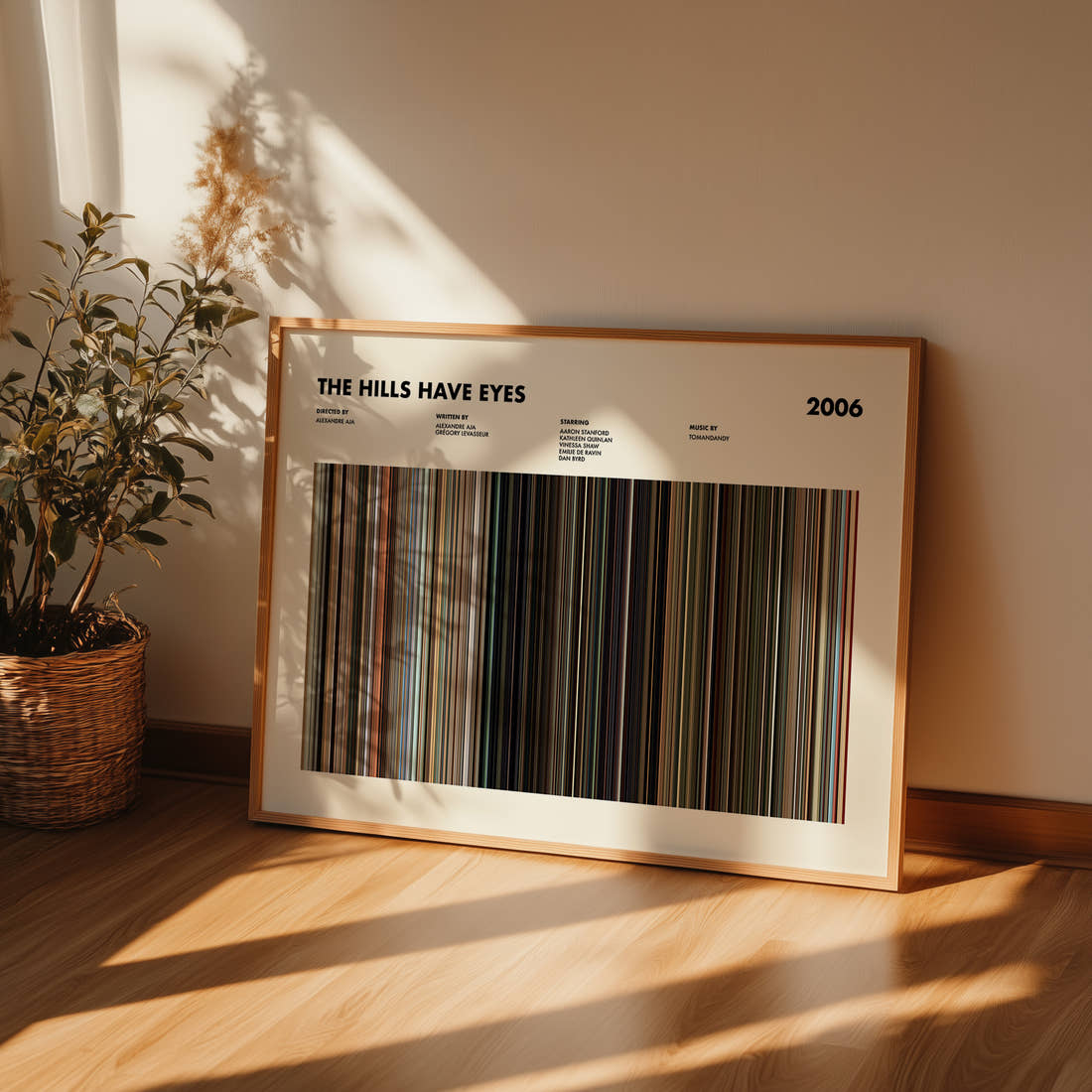 The Hills Have Eyes Movie Barcode Poster framed and leaning against a wall on a wooden floor