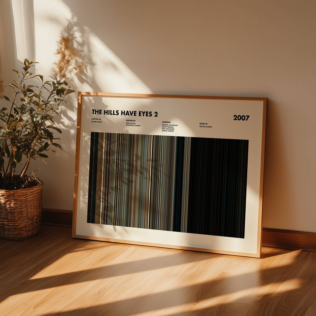 The Hills Have Eyes 2 Movie Barcode Poster framed and leaning against a wall on a wooden floor