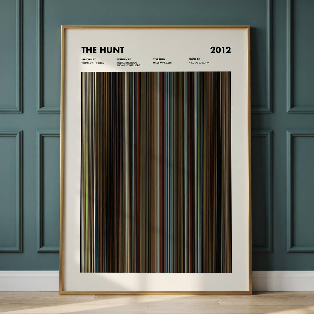 The Hunt 2012 Movie Barcode Poster framed and leaning against a panelled wall