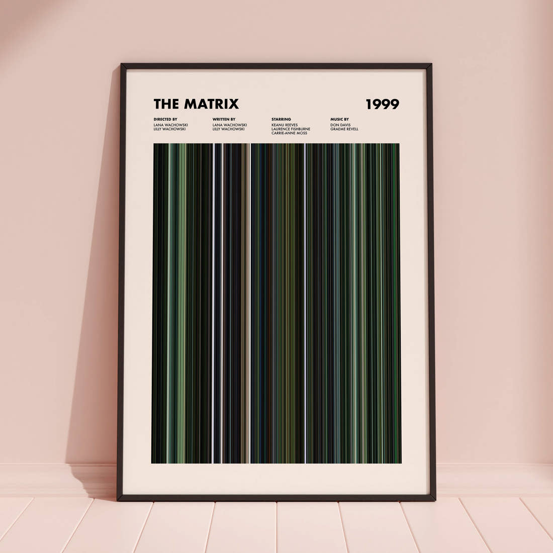 The Matrix Movie Barcode Poster framed and leaning against a coloured wall