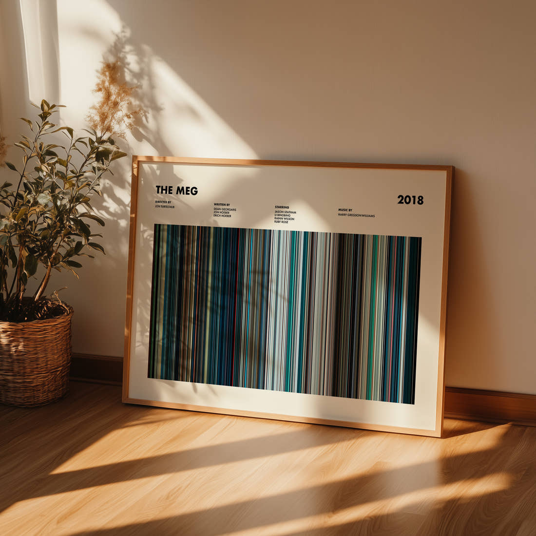 The Meg Movie Barcode Poster framed and leaning against a wall on a wooden floor