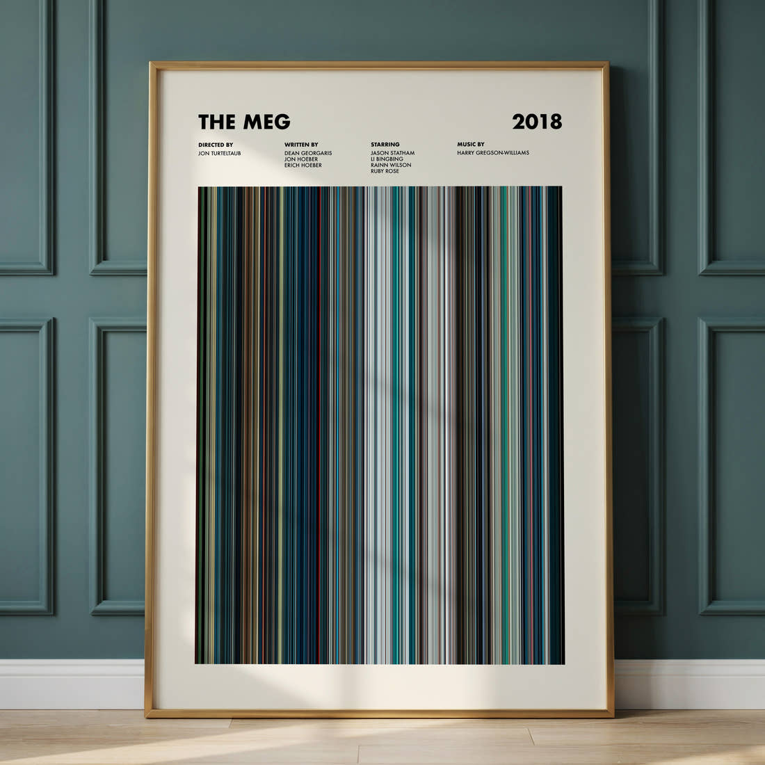 The Meg Movie Barcode Poster framed and leaning against a panelled wall