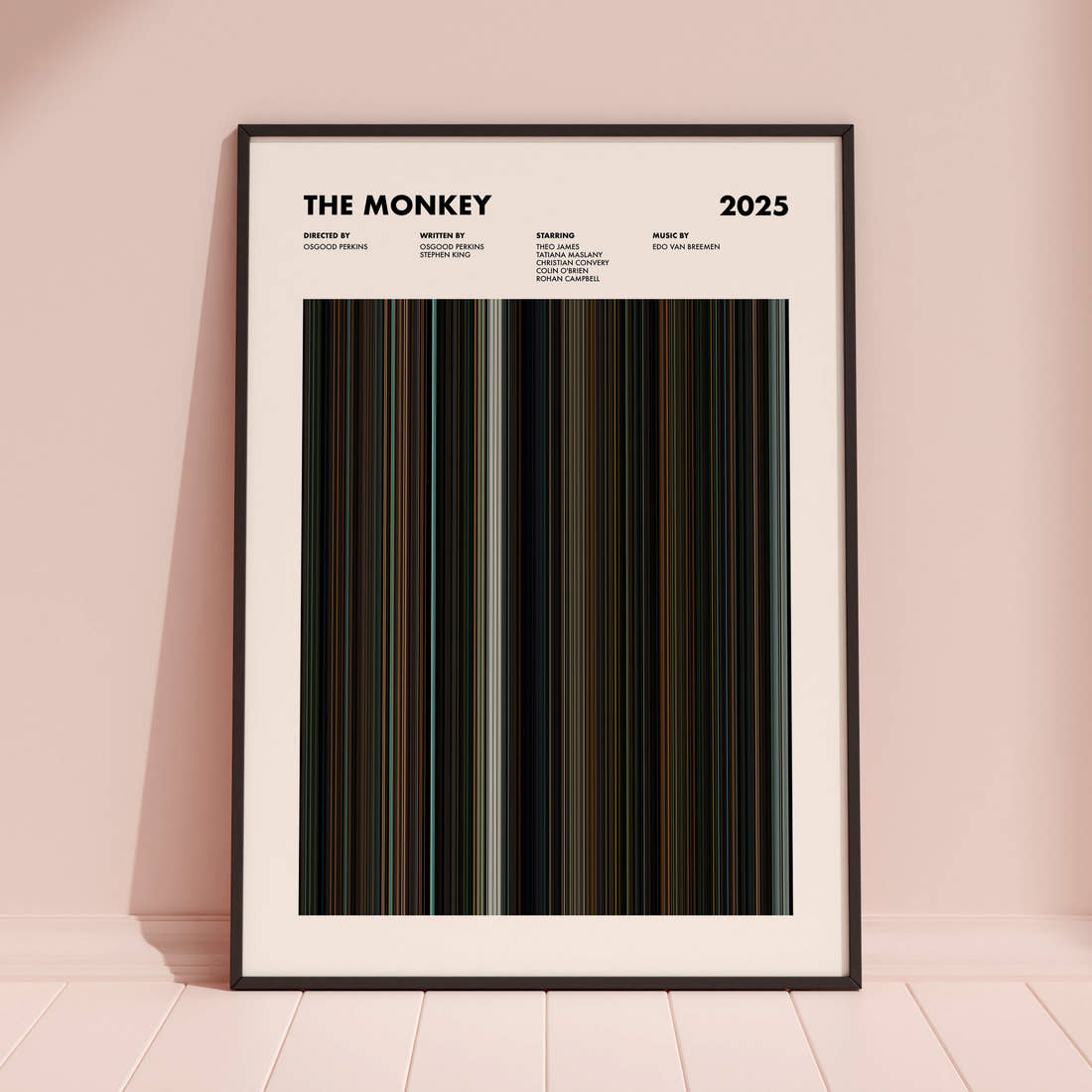 The Monkey Movie Barcode Poster framed and leaning against a coloured wall