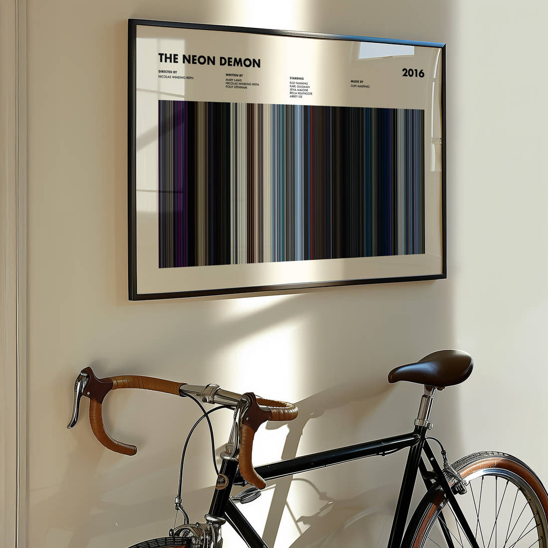 The Neon Demon Movie Barcode Poster framed on the wall of a styled room setting